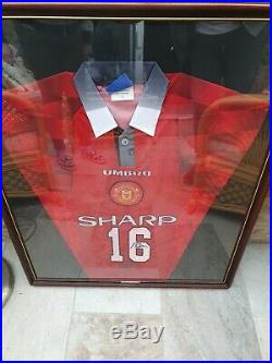 Framed Manchester United team shirt signed by Roy Keane